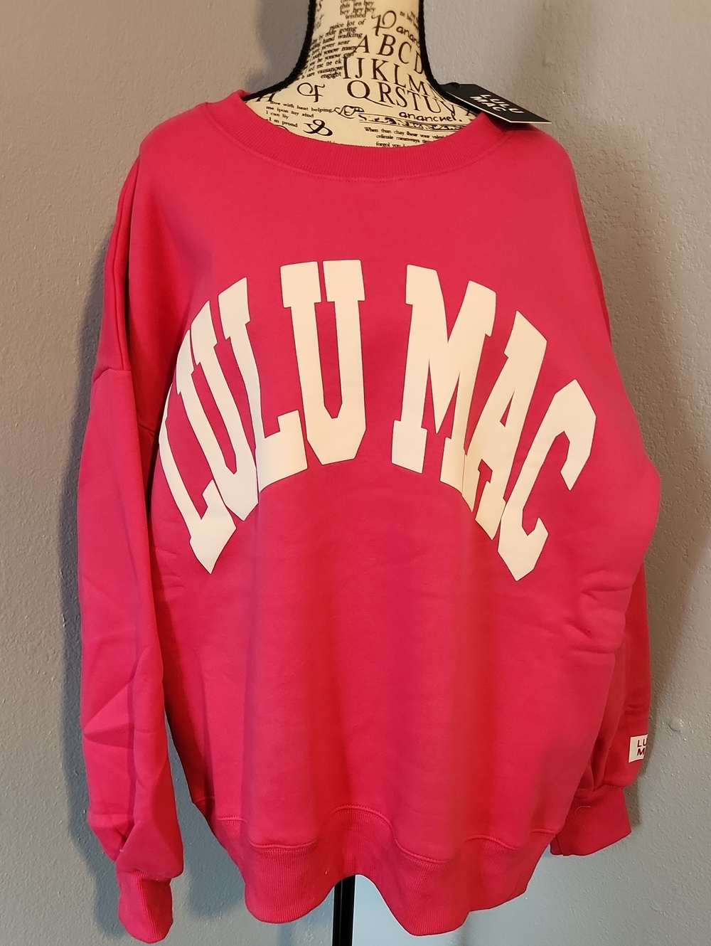 Lulu Mac pink crewneck sweater.